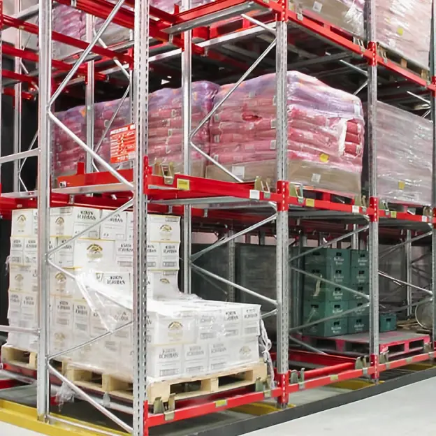 Push back pallet racking with spring rail system for high-density pallet storage